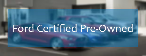 Blurred image of parked cars at a dealership with a prominent overlay reading "Ford Certified Pre-Owned" in white text, creating a professional tone.