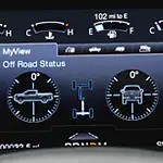 Dashboard display showing vehicle's off-road status. It features diagrams indicating pitch and roll at 0 degrees. Fuel gauge reads full, 102 miles to empty.